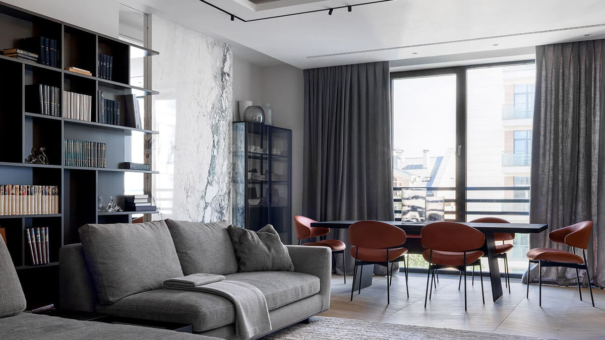 Квартира з сучасним дизайном, де поєднано кухню та вітальню у відкритому просторі.