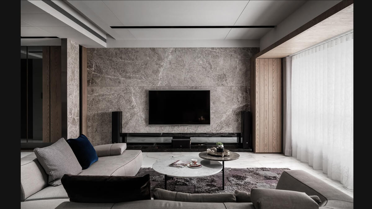 Дизайн вітальні в сірих тонах з яскравими акцентами, що роблять інтер'єр живим.