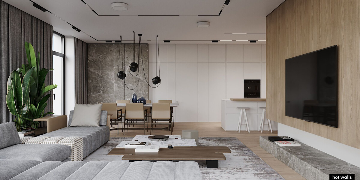 Сучасна вітальня з панорамними вікнами, що забезпечують багато природного світла.