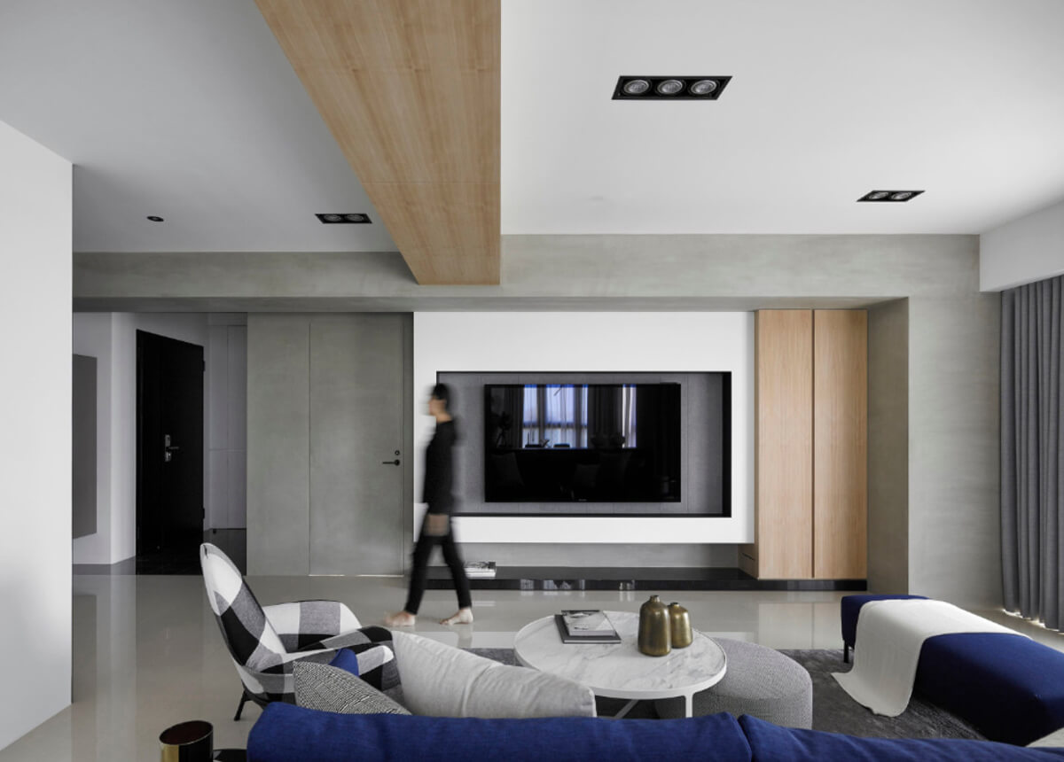 Елегантний дизайн вітальні з великим диваном та журнальним столиком.