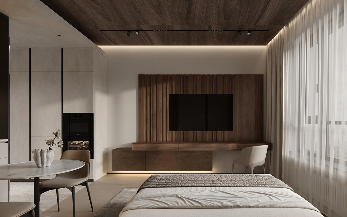 Практична робоча зона в спальні з зручним кріслом та мінімальним декором.