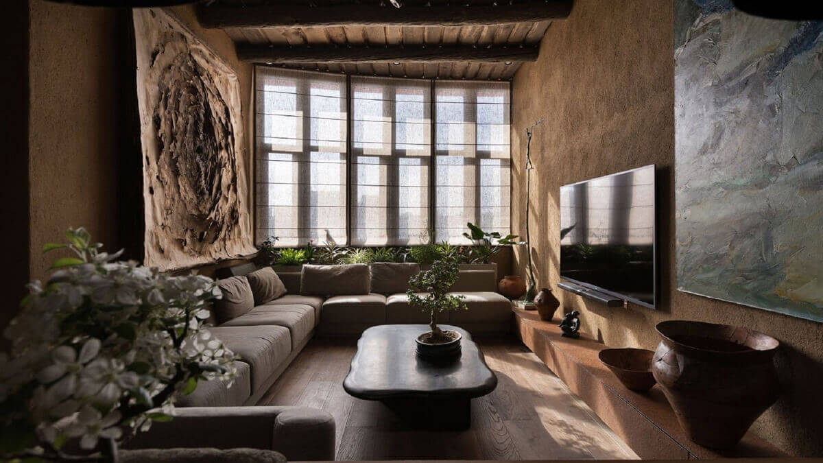 Світла вітальня у стилі вабі-сабі з лляними тканинами та керамічними вазами ручної роботи.