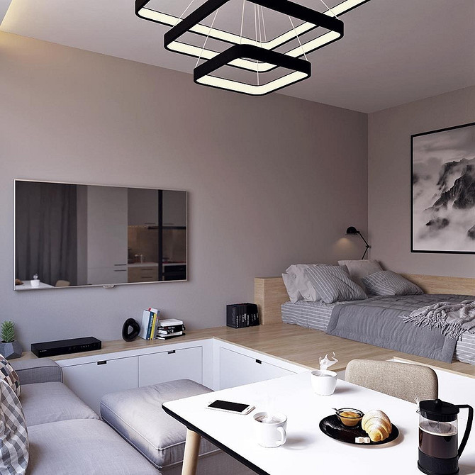 Інтер'єр спальні з подіумом, що виконує роль подіуму для ліжка та тумбочок.