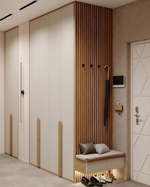 Дзеркало на торці шафи в спальні, що візуально збільшує простір.