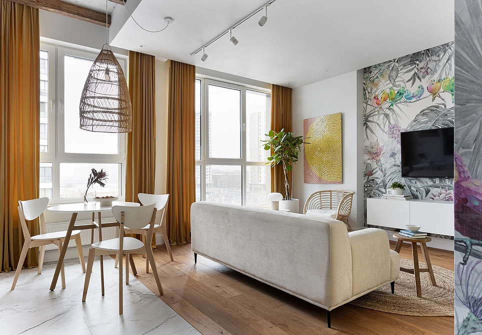 Кухня в білих тонах з обідньою зоною, світлі меблі створюють відчуття простору