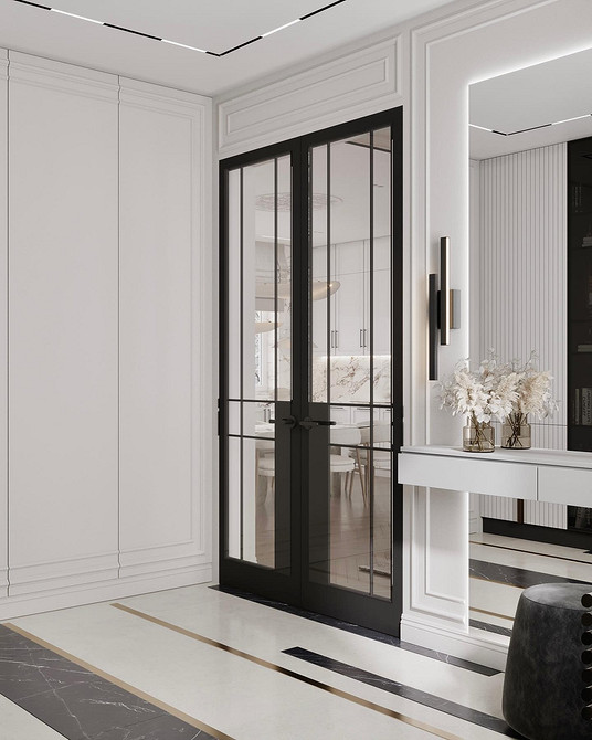 Оформлення спальні з білими меблями: шафа, ліжко та декор у мінімалістичному стилі.