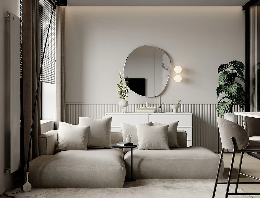 Сучасний інтер'єр: білий шкіряний диван з металевими ніжками та яскравими акцентами.