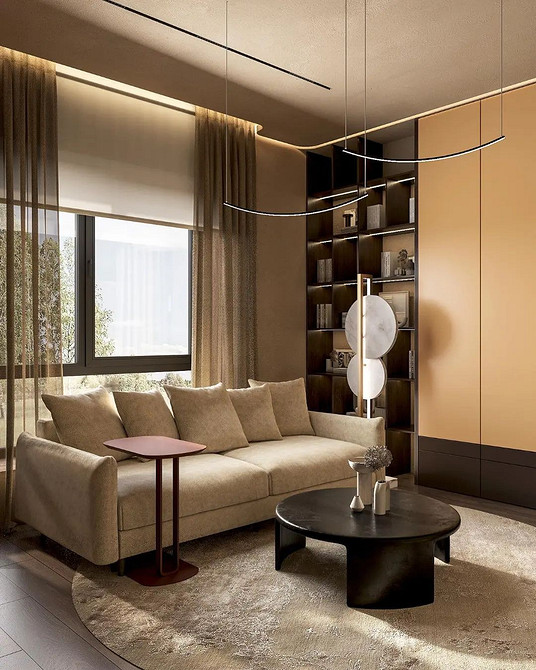 Розкішний бежевий велюровий диван з золотими ніжками в елегантній вітальні.