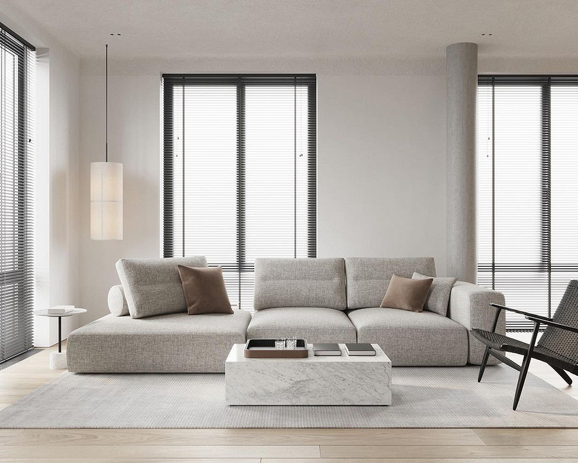 Затишна вітальня з бежевим диваном, каміном та теплим освітленням для відпочинку.