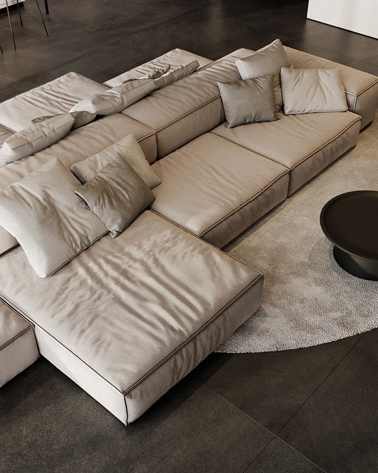 Бежевий диван з тканинною оббивкою в еклектичному інтер'єрі з яскравими деталями.