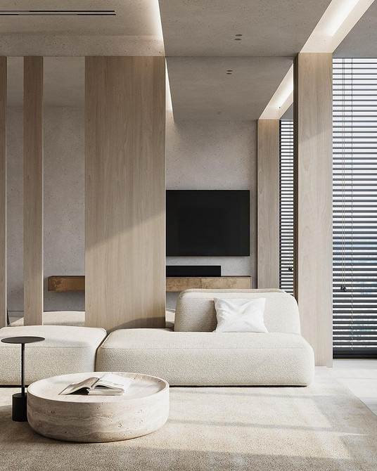 Бежевий шкіряний диван в класичному інтер'єрі з килимом та декоративними елементами.