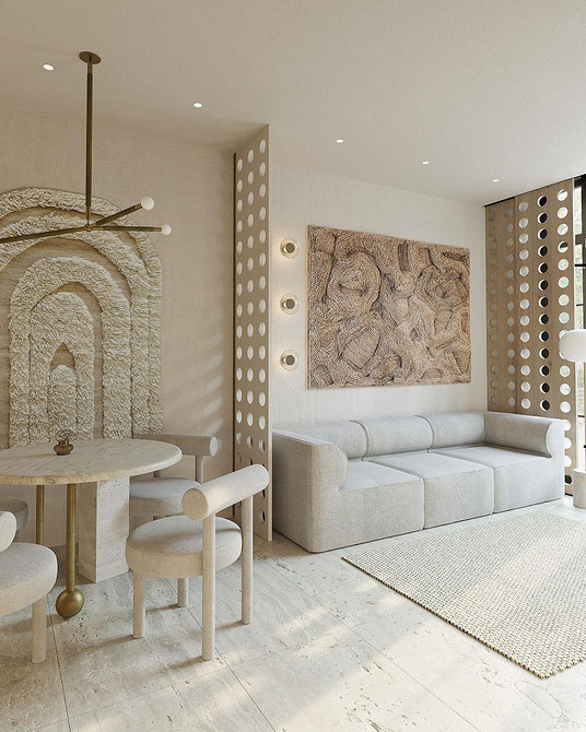 Дизайн вітальні з великим кутовим бежевим диваном та декоративними подушками.