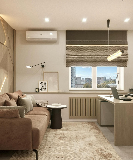 Мінімалістичний інтер'єр з бежевим диваном та білими стінами, підкреслений чорними акцентами.