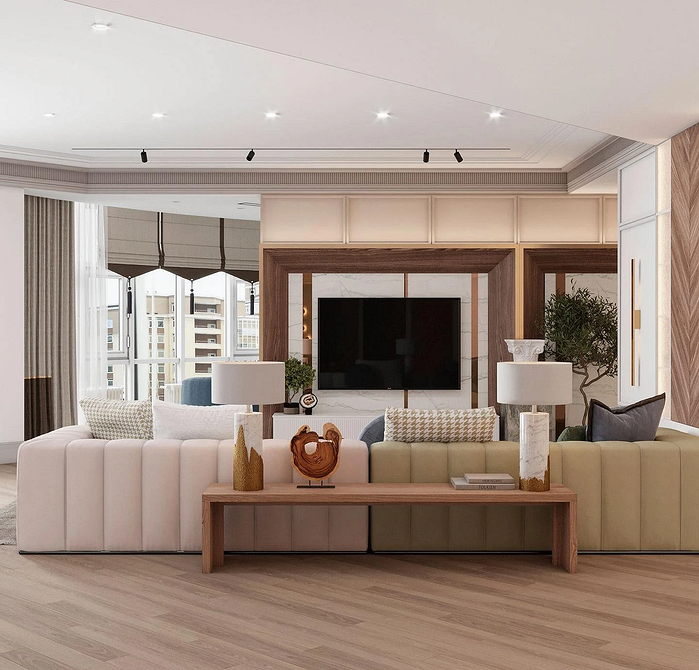 Великий сірий диван у вітальні, ідеальне місце для відпочинку та релаксації.