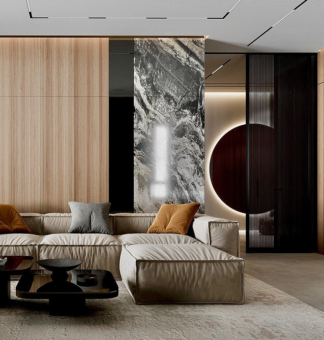 Диван з велюровою оббивкою глибокого синього кольору у вітальні.