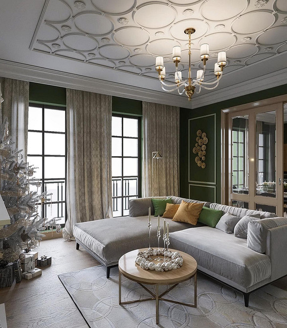 Великий диван у вітальні з подушками, що створює затишну атмосферу для відпочинку.