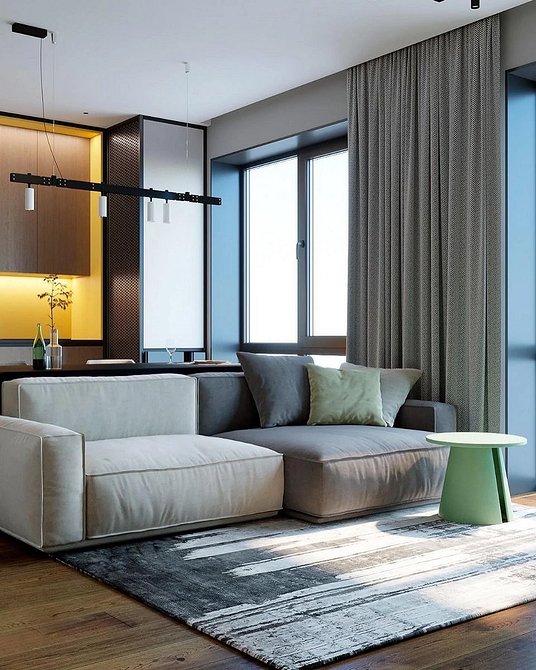 Диван з практичною та легкою у догляді оббивкою у мінімалістичній вітальні.