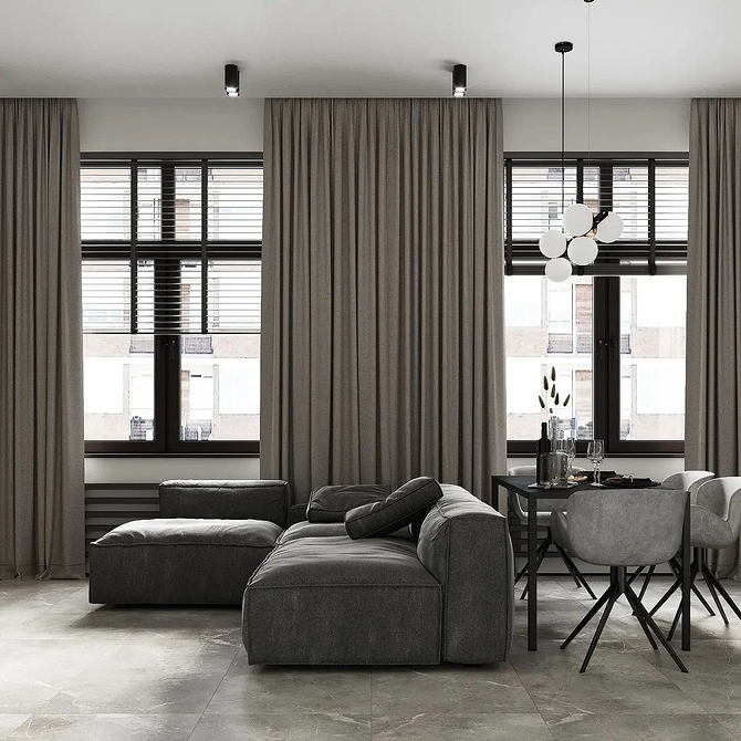 Інтер'єр вітальні з монохромним диваном, що підкреслює плавні лінії та гармонію простору.