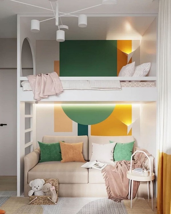 Дизайн дитячої кімнати з двоярусним ліжком, диваном та декоративними подушками.