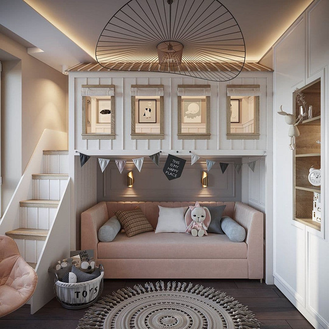 Інтер'єр дитячої кімнати з двоярусним ліжком з диваном та робочою зоною.