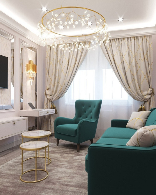 Стильний інтер'єр з бірюзовим диваном, рослинами та сучасним декором