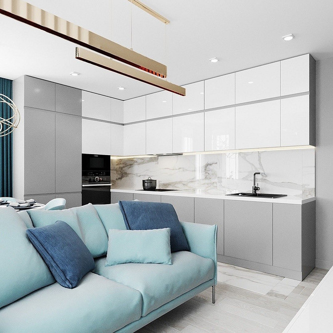 Сучасний дизайн вітальні з бірюзовим диваном на фоні світло-сірих стін.