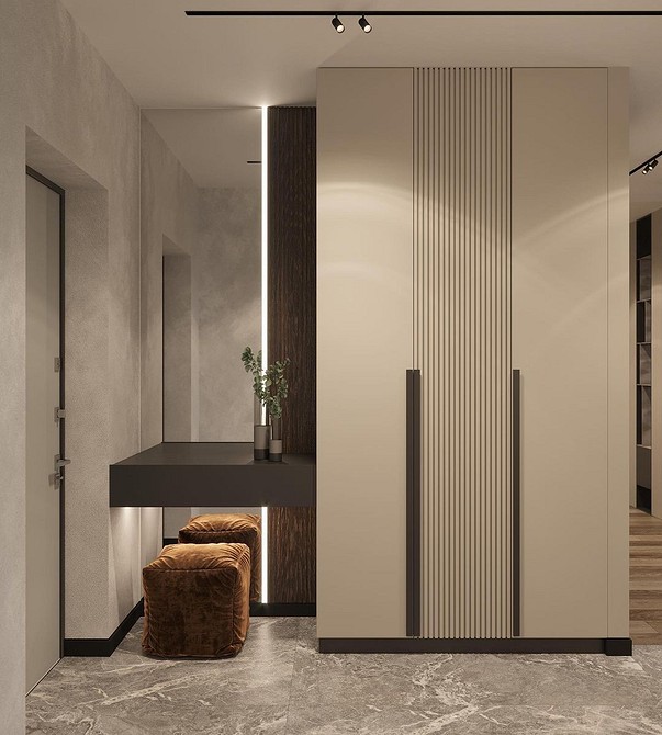 Світла шафа в передпокій з лаконічним дизайном та зручними ручками.