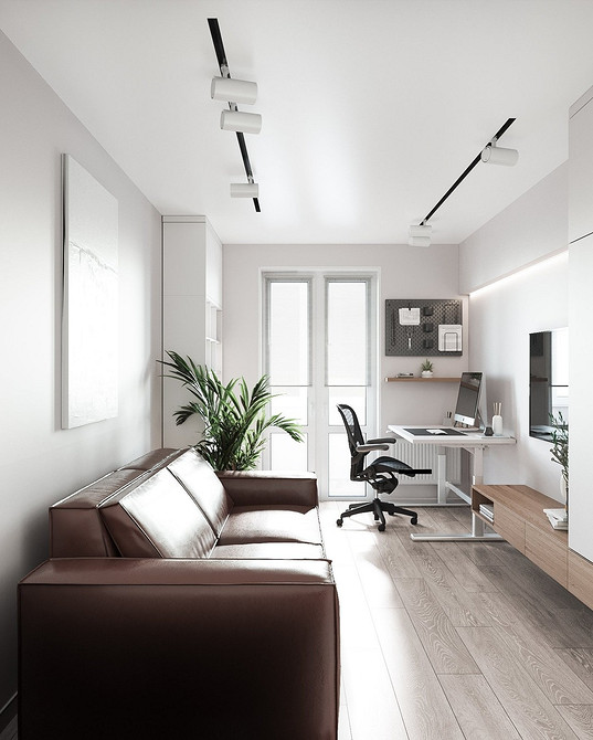 Великий коричневий диван в мінімалістичному інтер'єрі, акцент на функціональності та комфорті