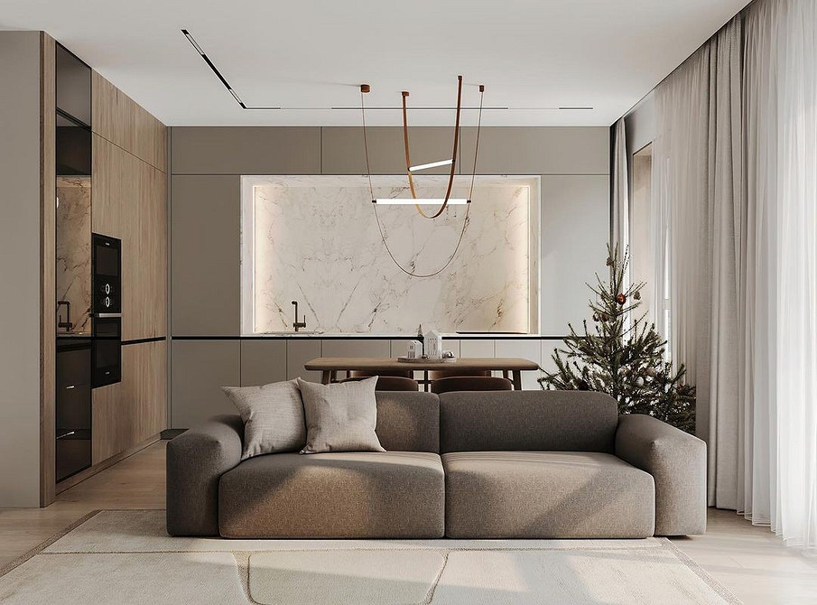 Коричневий велюровий диван з яскравими подушками в інтер'єрі в стилі бохо