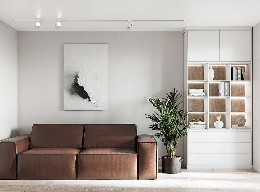 Компактний коричневий диван в інтер'єрі, ідеальне поєднання кольорів та затишку.