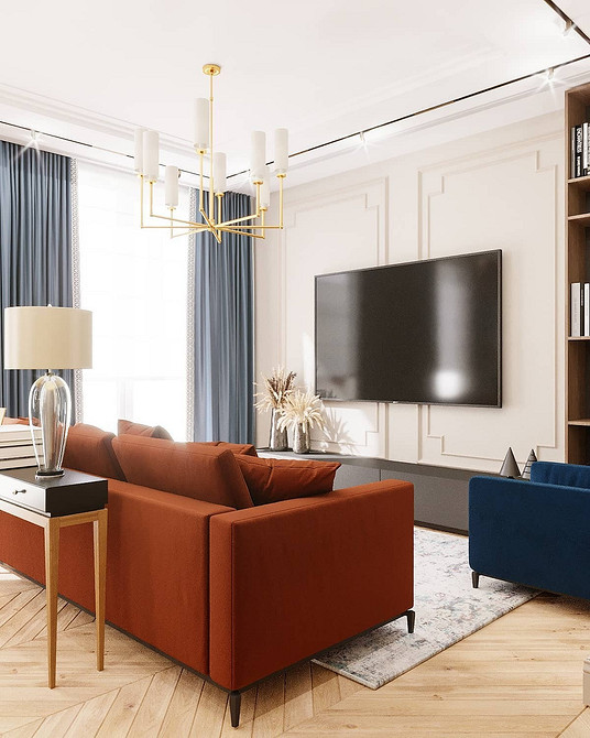 Сучасний червоний диван у вітальні з мінімалістичним дизайном та яскравими подушками