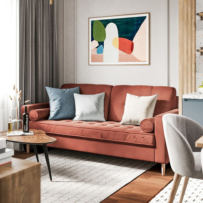 Комфортний червоний диван з подушками різних розмірів у світлій вітальні, затишок в домі