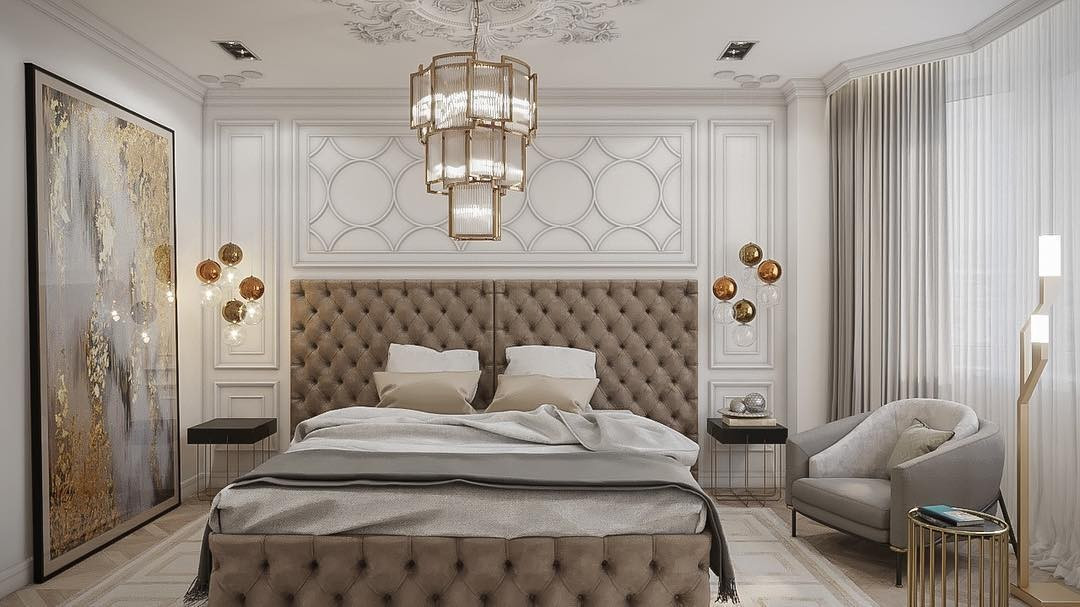 Стильна спальня з ліжком з м'яким узголів'ям та елегантним дизайном інтер'єру.