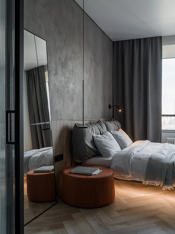 Дизайн спальні 2025: сучасне ліжко з акцентною постільною білизною.