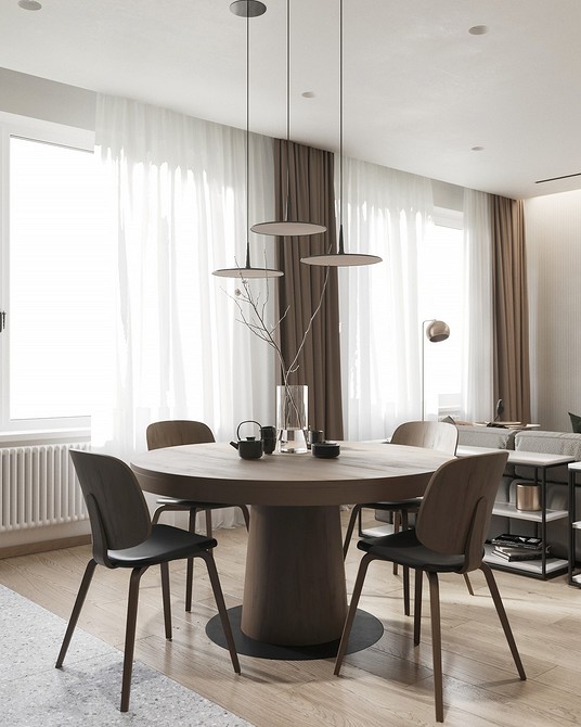 Стильний круглий обідній стіл в інтер'єрі вітальні, ідеальний для сімейних зустрічей.