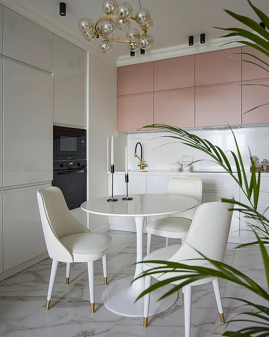 Сучасний круглий обідній стіл з металевими ніжками, огляд дизайну