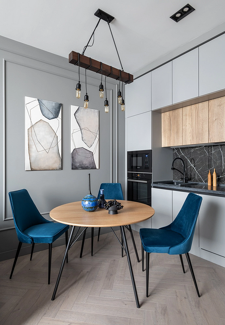 Круглий обідній стіл в мінімалістичному інтер'єрі, поради щодо вибору форми