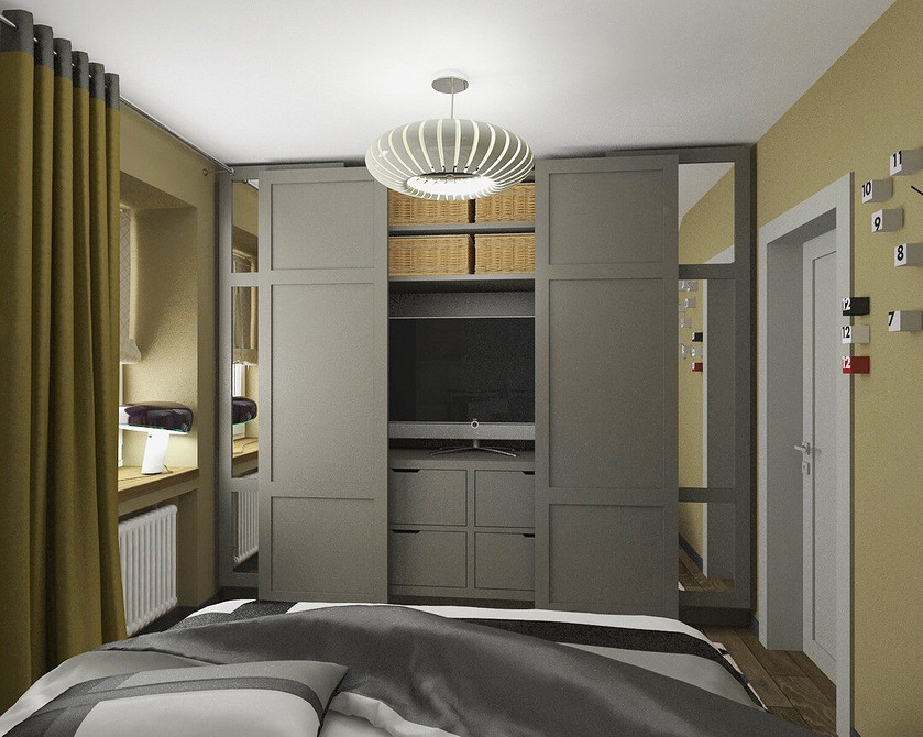 Класичний дизайн ніші під телевізор з молдингами та пофарбований у нейтральний колір.