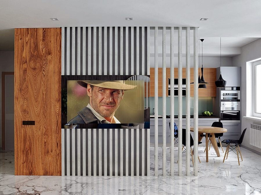 Ніша для телевізора з підсвічуванням та декоративними елементами з металу та дерева.