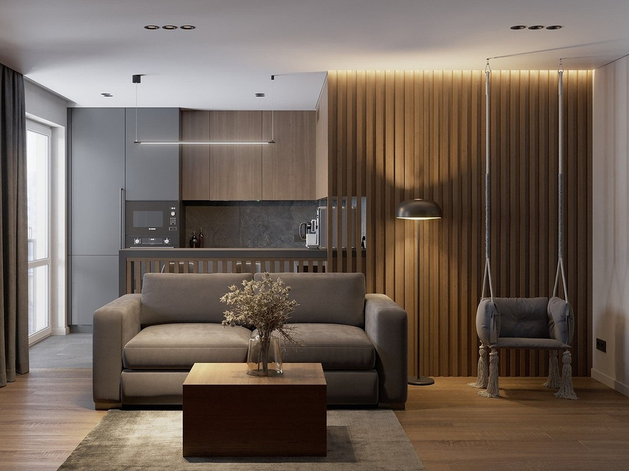 Підвісне крісло з ротангу в інтер'єрі, природний та екологічний дизайн зони відпочинку.