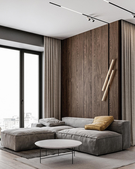 Елегантний диван з подушками, дизайн інтер'єру в природних відтінках