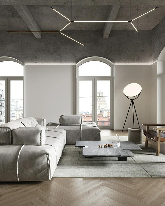 Великий кутовий диван в світлій вітальні, сучасний дизайн інтер'єру.