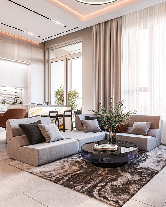 Великий диван у світлій вітальні з сучасним дизайном інтер'єру