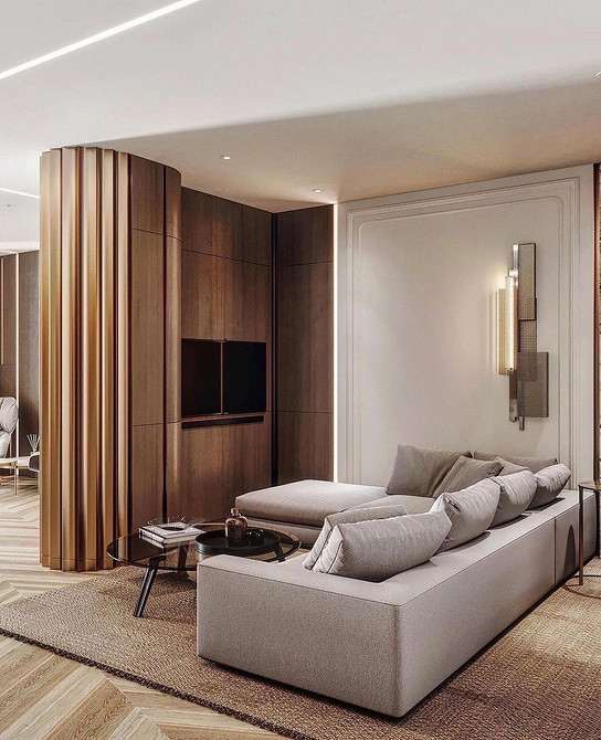 Диван в сучасному інтер'єрі з декоративними подушками та пледом