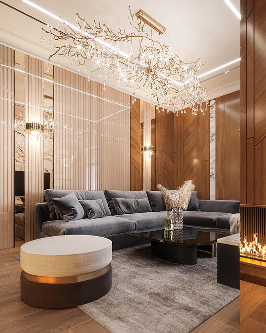 Кутовий диван з м'якою оббивкою у просторій вітальні з великими вікнами