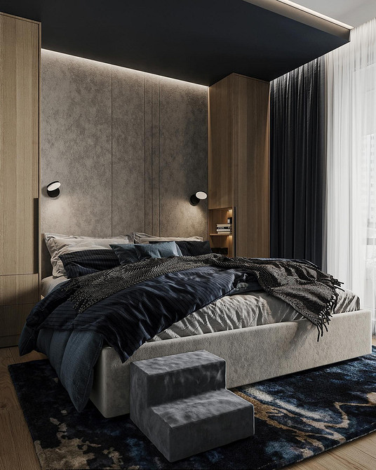 Комфортна сіра ліжко з м'яким узголів'ям та декоративними подушками в спальні.