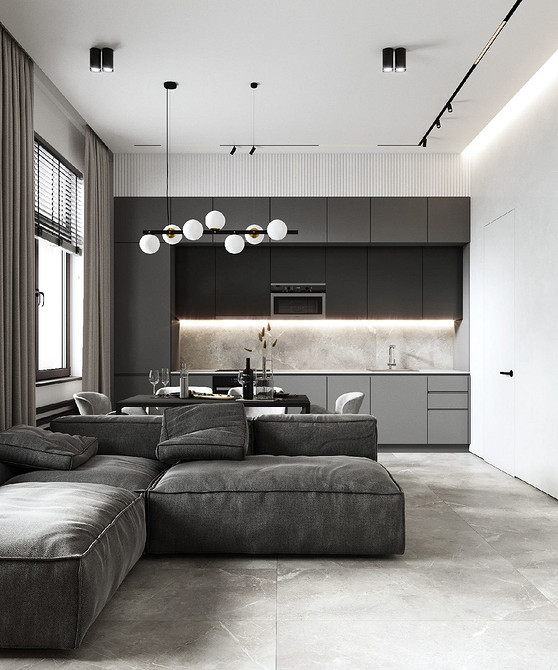 Сірий кутовий диван у вітальні, що забезпечує достатньо місця для всієї родини.