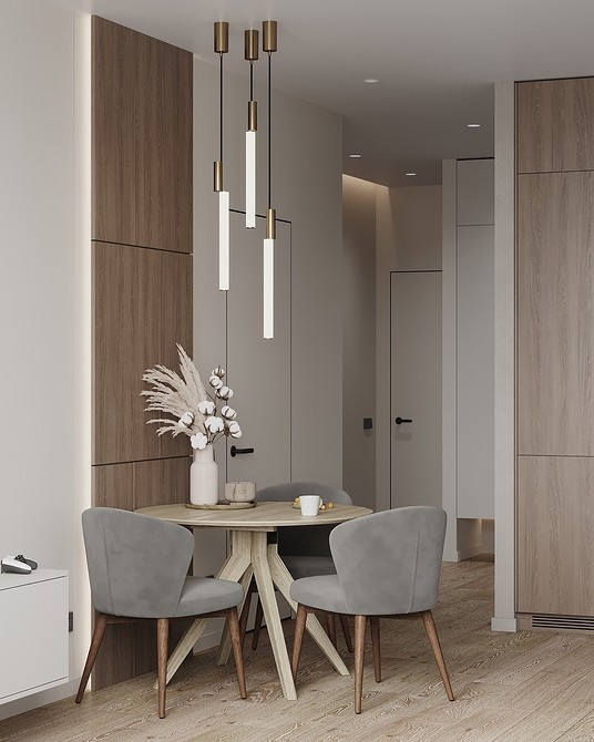 М'які сірі крісла в інтер'єрі вітальні: комфортний куточок для відпочинку.