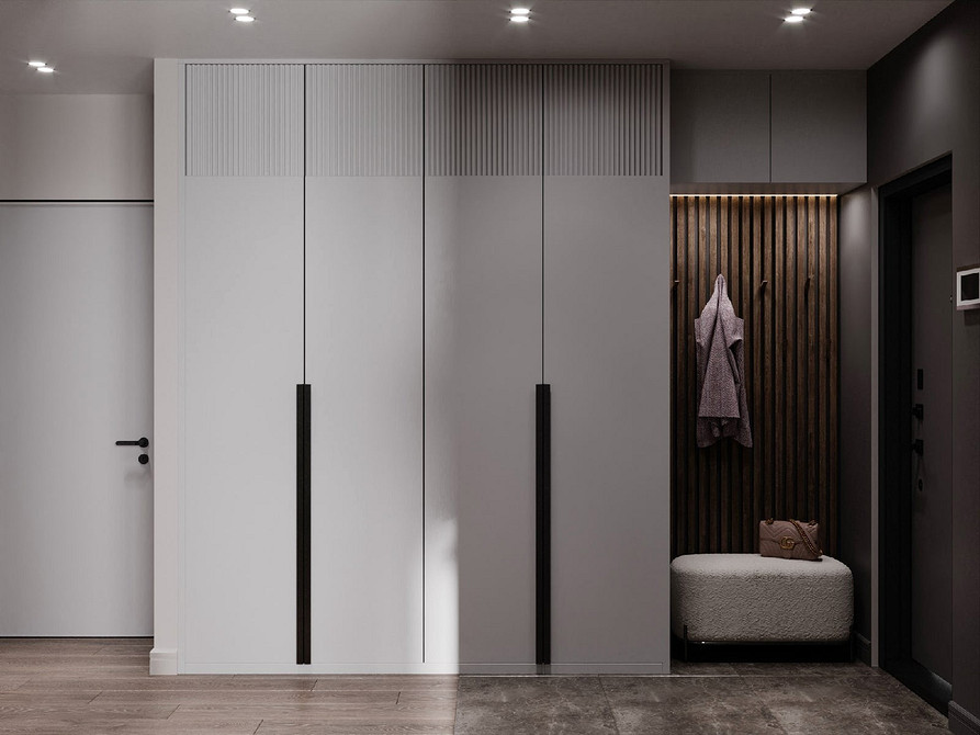 Сіра кухня з білою стільницею та дерев'яними акцентами, що створює сучасний та стильний вигляд.