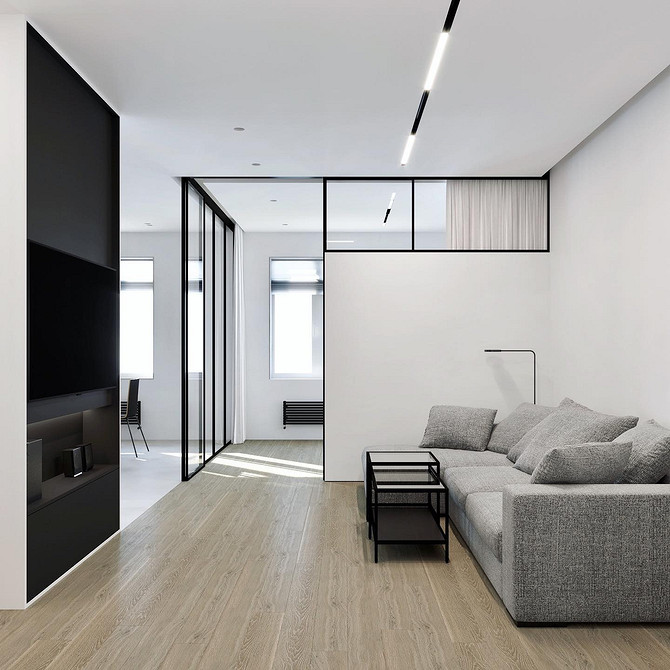 Скандинавський інтер'єр з сірим диваном, дерев'яними елементами та рослинами